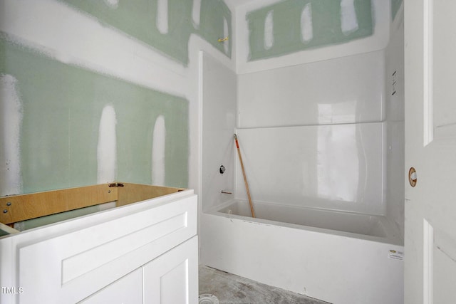 bathroom featuring a tub to relax in