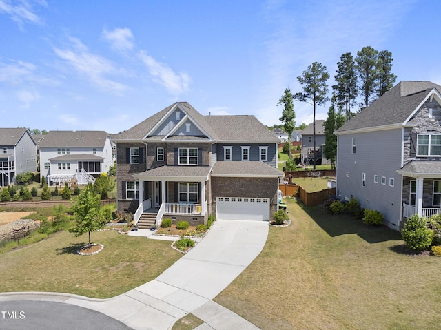 view of front of property with a porch, a garage, a residential view, and concrete driveway
