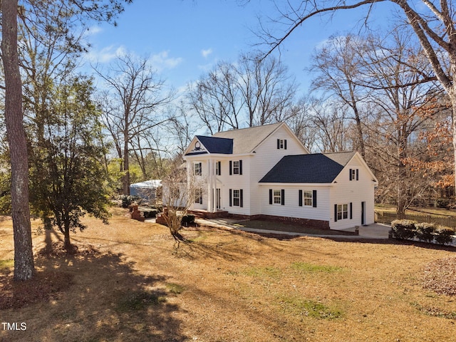 exterior space with a patio area and a lawn