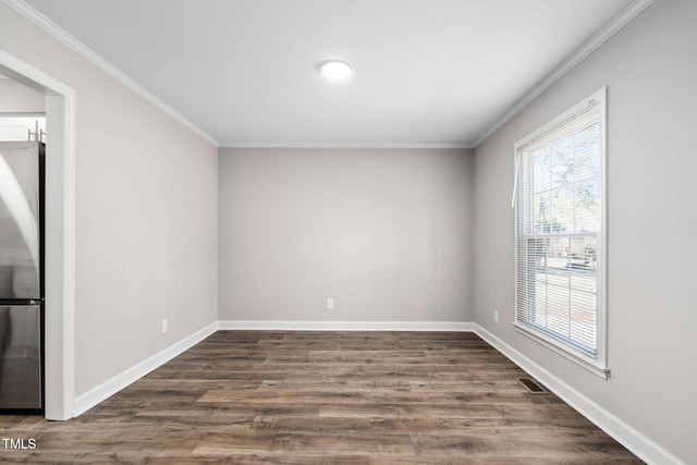 unfurnished room with crown molding and dark wood-type flooring