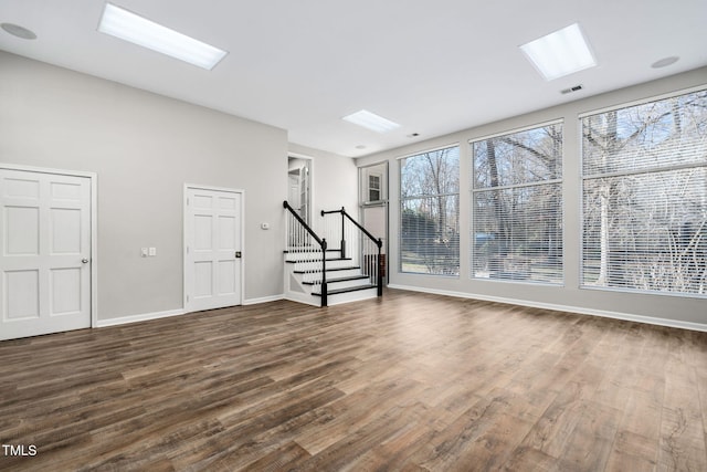 unfurnished living room with hardwood / wood-style flooring