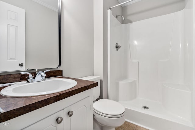 bathroom with walk in shower, ornamental molding, vanity, tile patterned flooring, and toilet