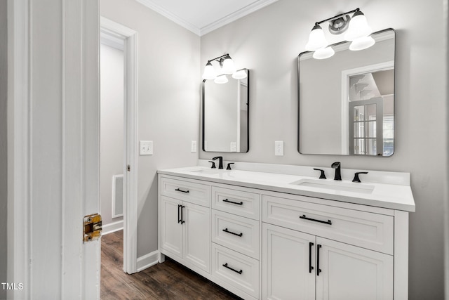 bathroom with hardwood / wood-style flooring, vanity, and ornamental molding