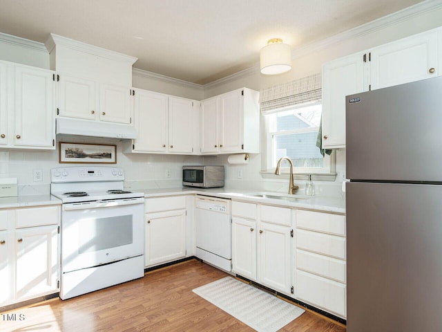 kitchen with light hardwood / wood-style floors, stainless steel appliances, crown molding, sink, and white cabinetry