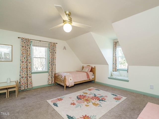 unfurnished bedroom featuring vaulted ceiling, ceiling fan, and carpet