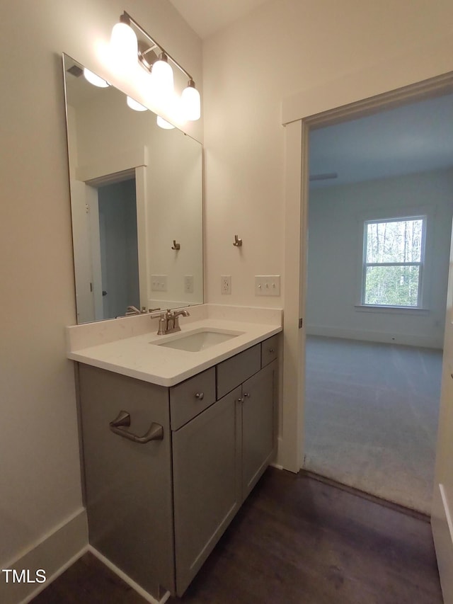 bathroom with baseboards and vanity