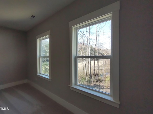 interior space featuring baseboards