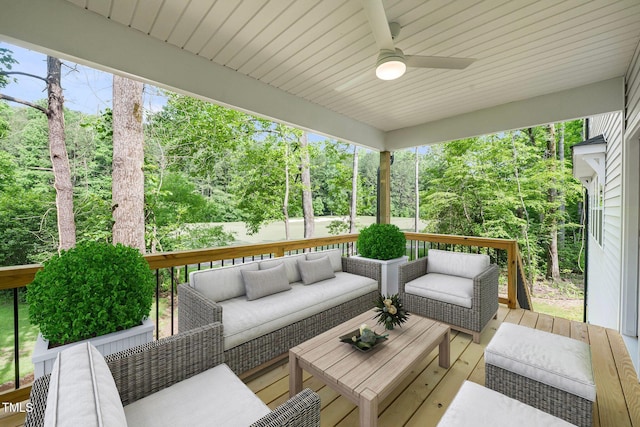 632 Angus Ct, Sanford, NC 27332 - deck with an outdoor hangout area, a ceiling fan, and view of wooded area
