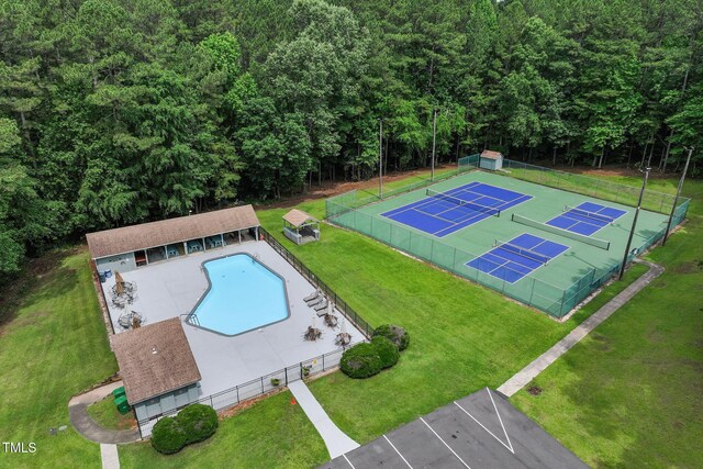 632 Angus Ct, Sanford, NC 27332 - drone / aerial view of a pool and a heavily wooded area