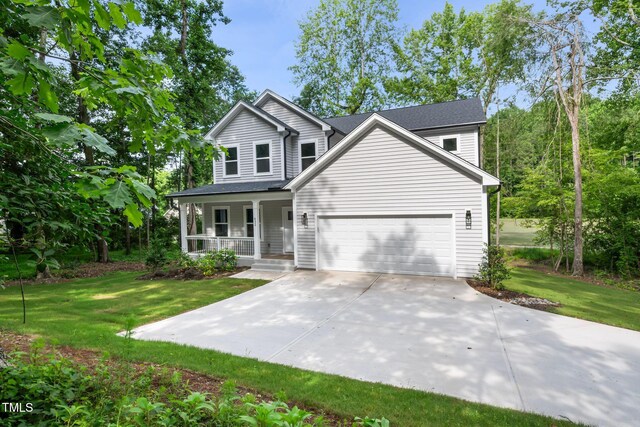 632 Angus Ct, Sanford, NC 27332 - traditional-style house featuring a porch, a front lawn, an attached garage, and driveway