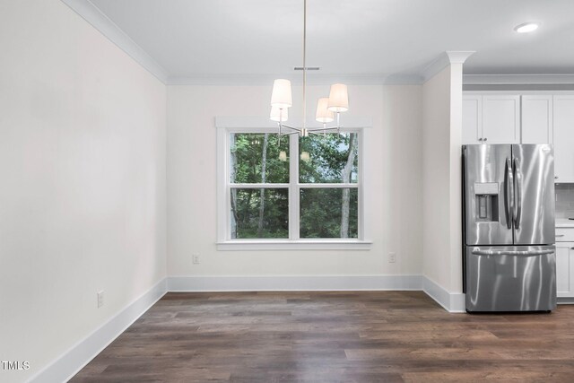 632 Angus Ct, Sanford, NC 27332 - kitchen with stainless steel fridge, ornamental molding, a chandelier, white cabinetry, and baseboards