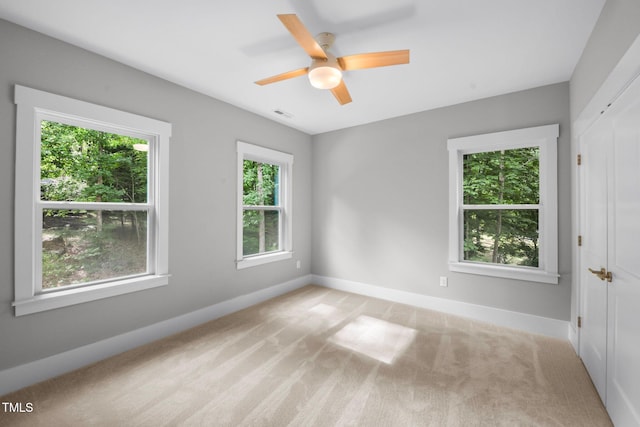 632 Angus Ct, Sanford, NC 27332 - unfurnished room with light carpet, baseboards, and ceiling fan