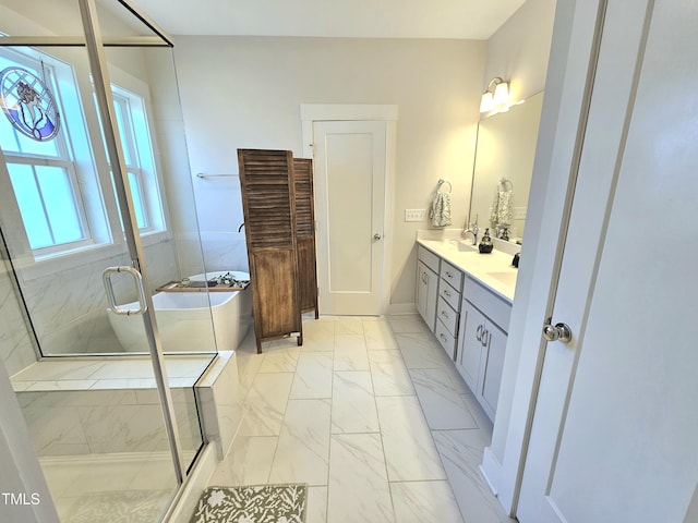 bathroom featuring separate shower and tub and vanity