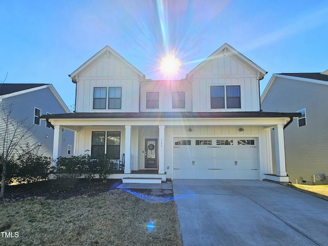 view of front of property featuring covered porch and a garage