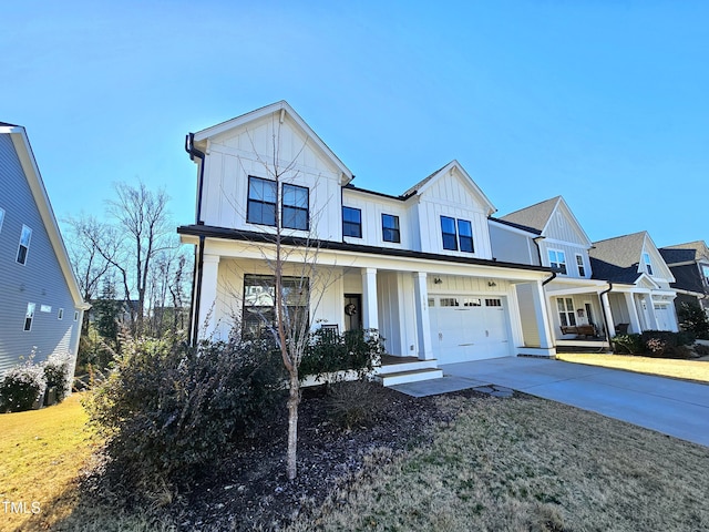 view of front of property with driveway, a porch, board and batten siding, and an attached garage