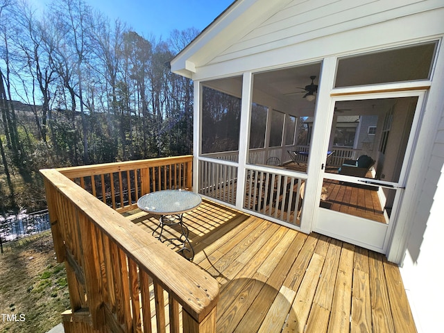 wooden terrace featuring a sunroom