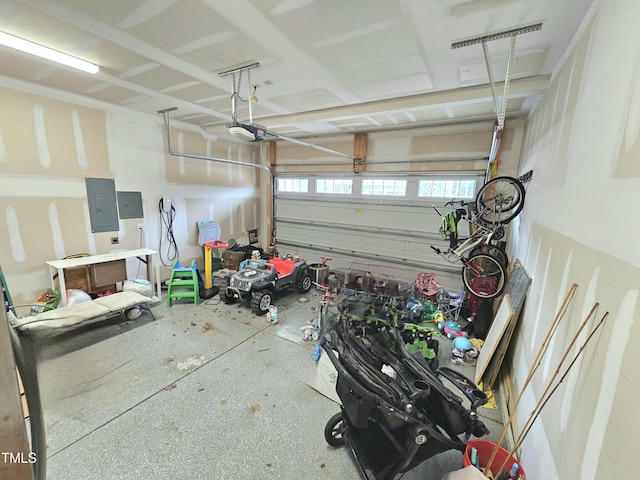 garage featuring electric panel and a garage door opener