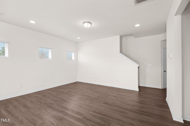 unfurnished room with dark hardwood / wood-style flooring