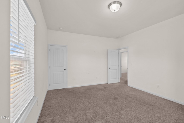 spare room featuring carpet