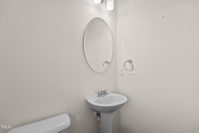 bathroom with toilet and sink