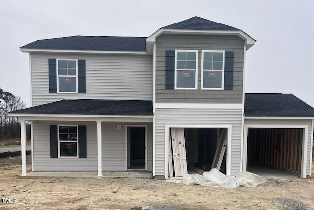 view of front of property with a garage and a porch