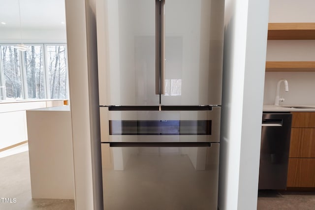 interior details featuring appliances with stainless steel finishes and sink