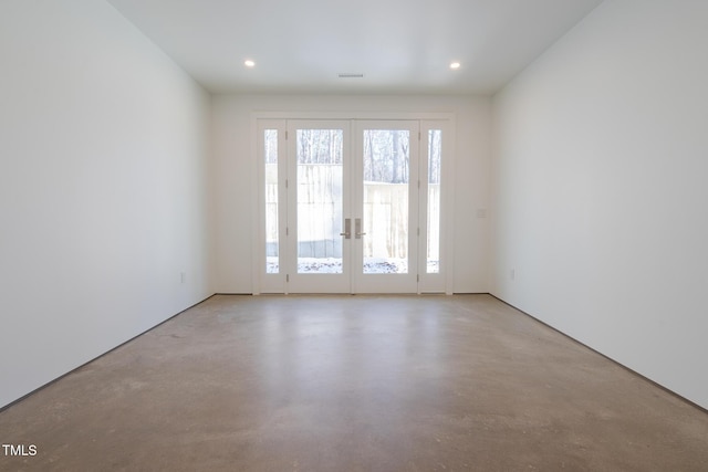 unfurnished room with french doors