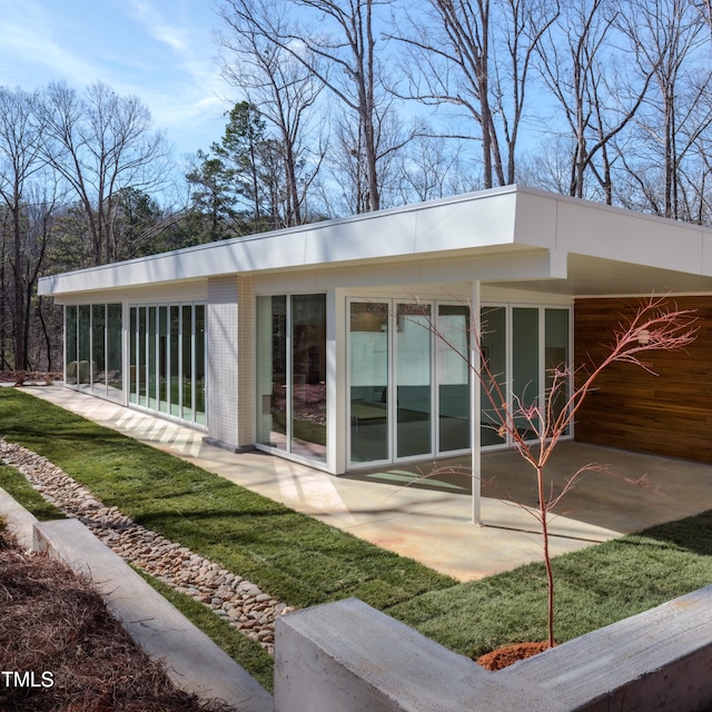 back of property with a patio