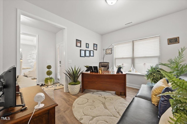 office with hardwood / wood-style flooring