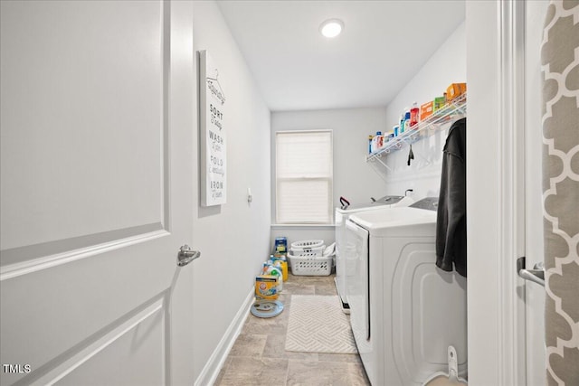 laundry room featuring washing machine and clothes dryer