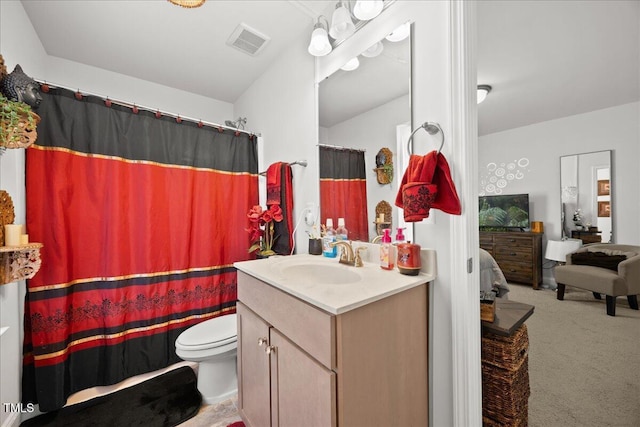 bathroom with vanity and toilet