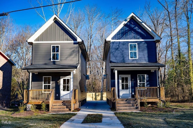 view of front of property featuring covered porch and a front lawn