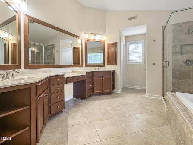 full bathroom with a stall shower, visible vents, lofted ceiling, tile patterned floors, and vanity