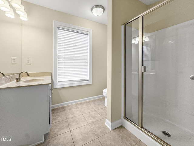 full bath with toilet, a shower stall, vanity, and tile patterned floors