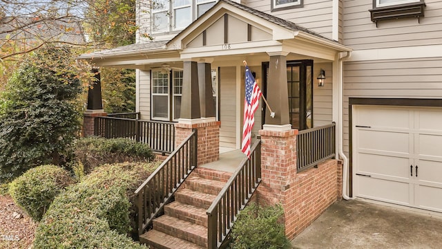 property entrance with a garage, a porch, and brick siding