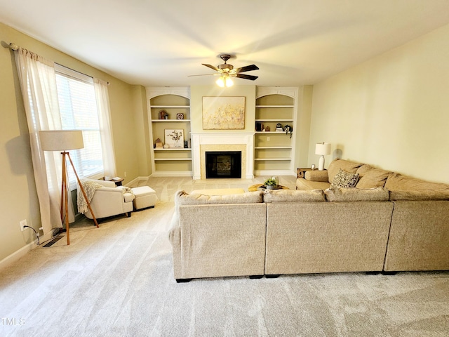 living room featuring carpet floors, a fireplace with flush hearth, built in shelves, and baseboards