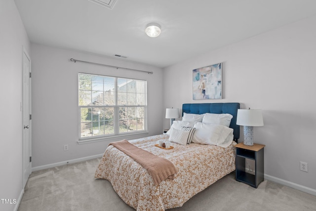 bedroom featuring light carpet