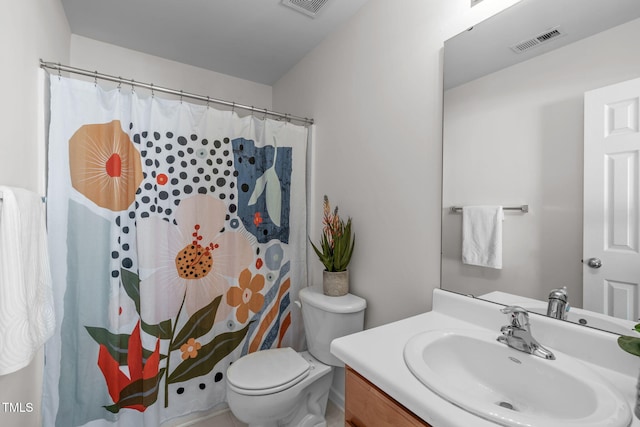 bathroom with vanity, toilet, and walk in shower