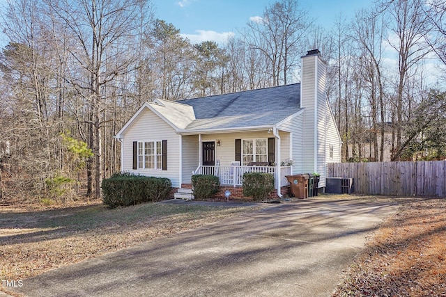 single story home featuring central AC unit