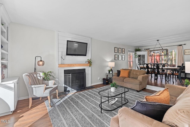 living room with a fireplace and hardwood / wood-style floors