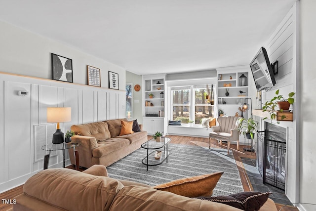 living room with a fireplace and hardwood / wood-style flooring