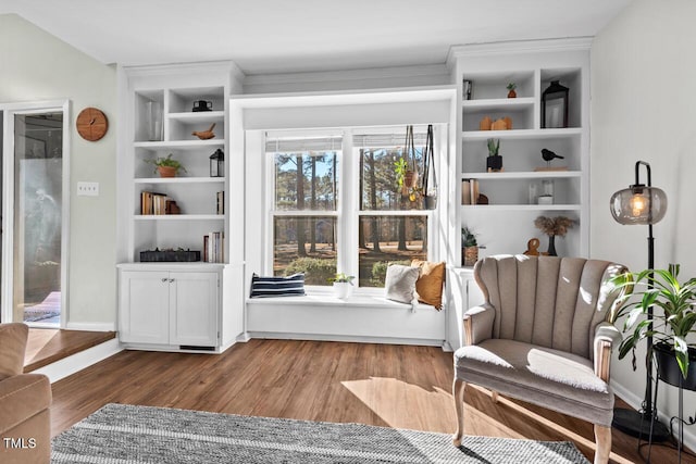 sitting room with wood-type flooring