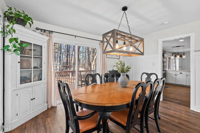 dining area with dark hardwood / wood-style floors