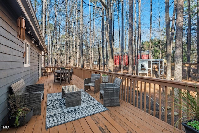 deck featuring outdoor lounge area