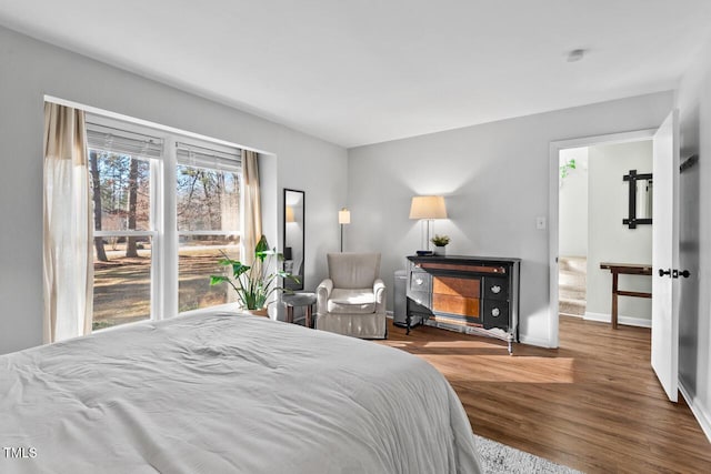 bedroom with hardwood / wood-style floors