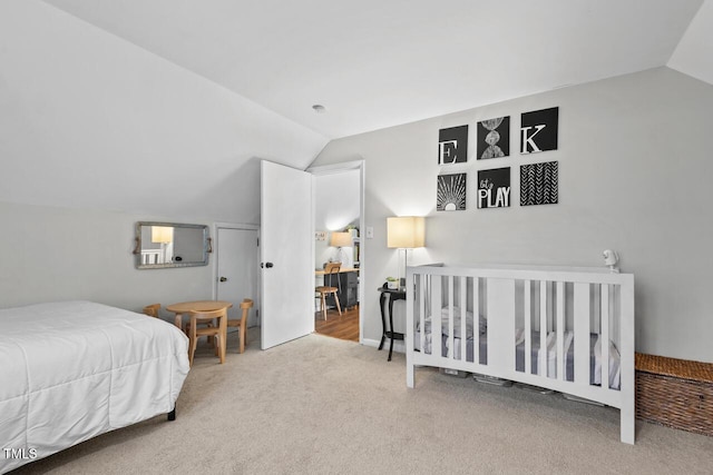 carpeted bedroom with vaulted ceiling