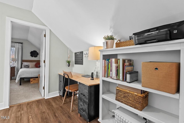 office area with lofted ceiling and dark wood-type flooring