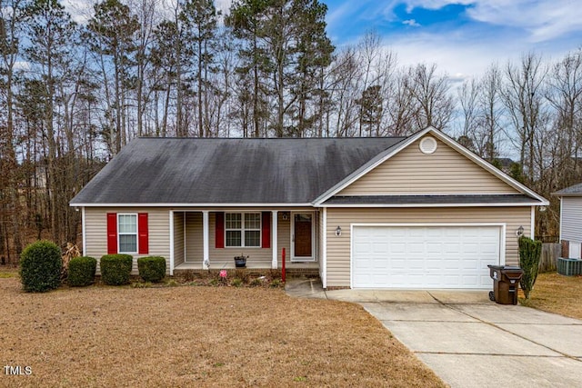 ranch-style house with a garage and a front lawn