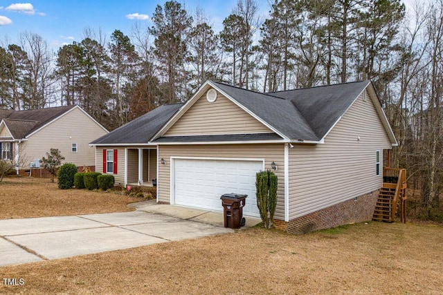 view of front of home featuring a garage and a front yard