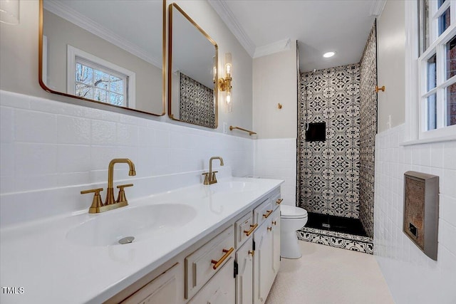 bathroom featuring toilet, crown molding, tile walls, and vanity